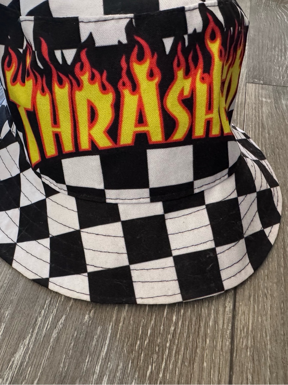Thrasher Black & White Checkerboard Bucket Hat with Yellow-Red Flame Logo